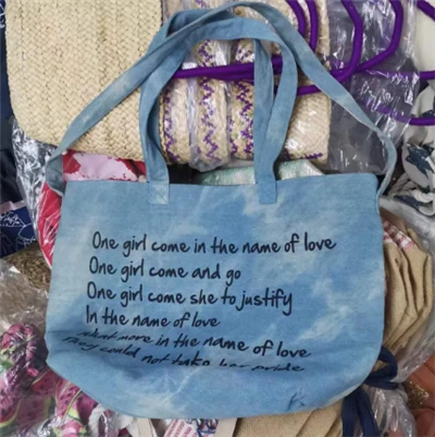 Damestas van denimstof met twee handvatten
